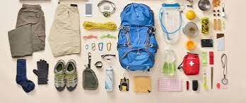 Kenya safari packing essentials backpack gear laid out flatlay